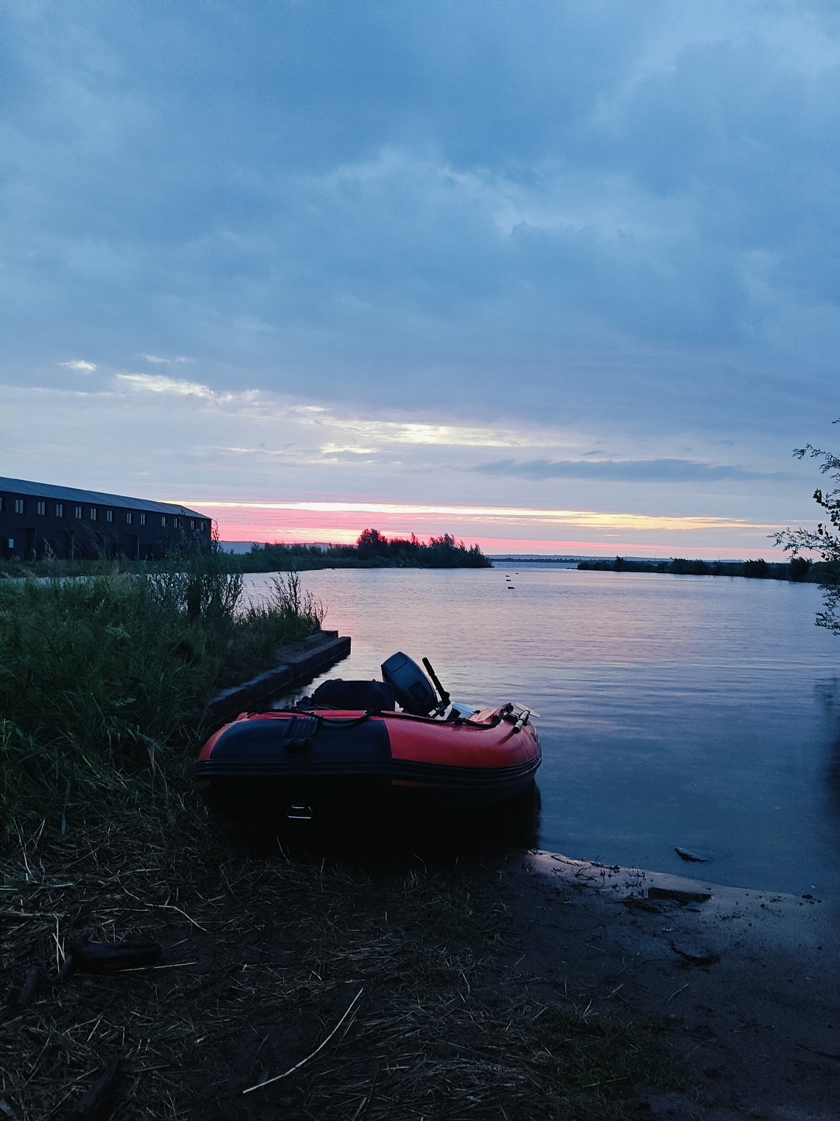 Inflatable boat on the Kama River at sunset, Chaikovsky