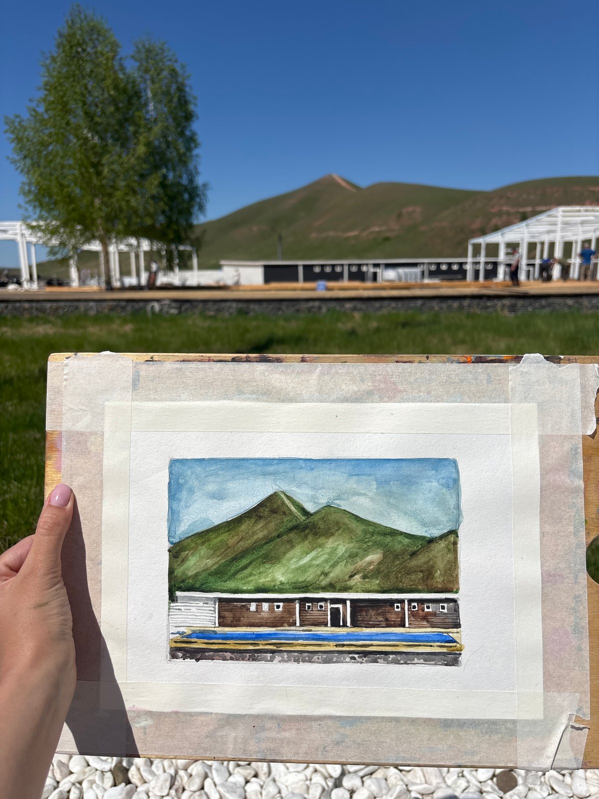 Artist documents early morning outdoor painting session in Drokino
