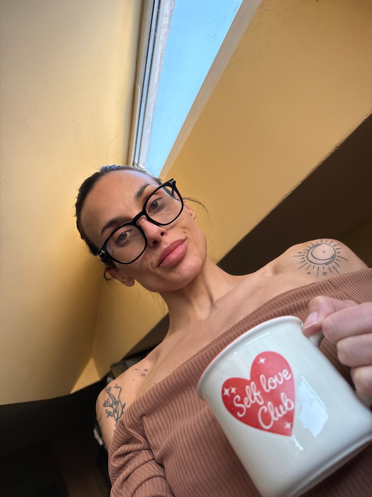 Woman with Self Love Club mug captured in Pleven