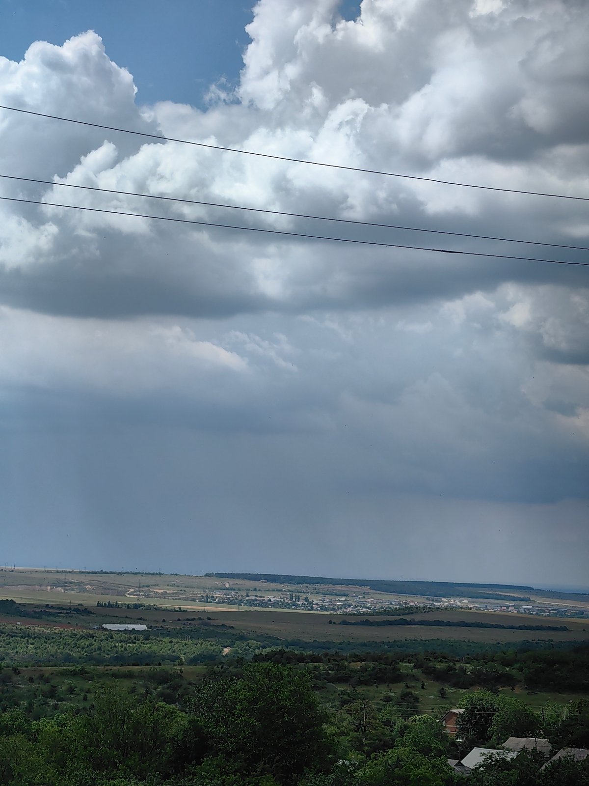 Storm clouds gather as strawberries harvested in rural area