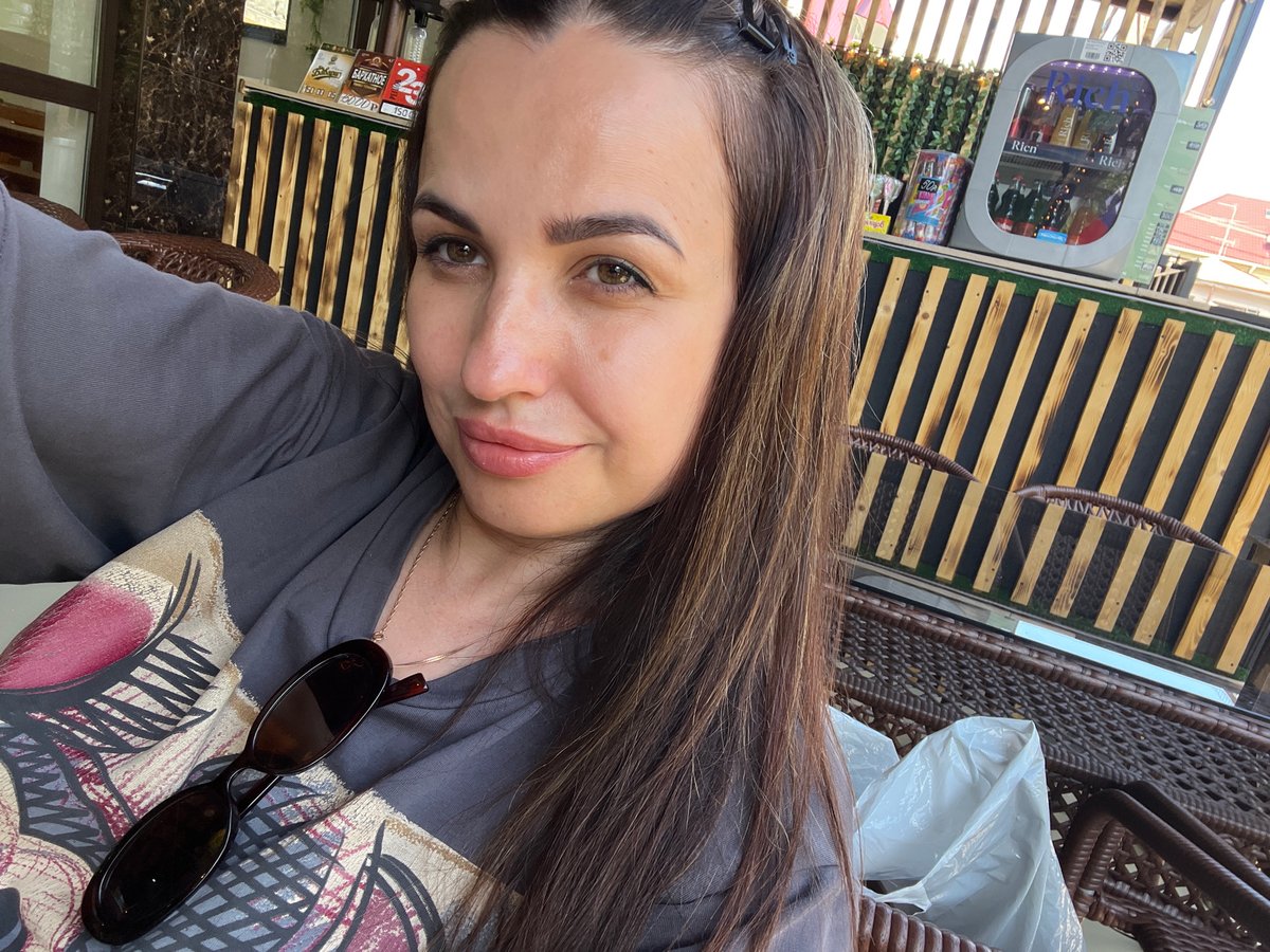 Woman documents casual afternoon outing with extended selfie session