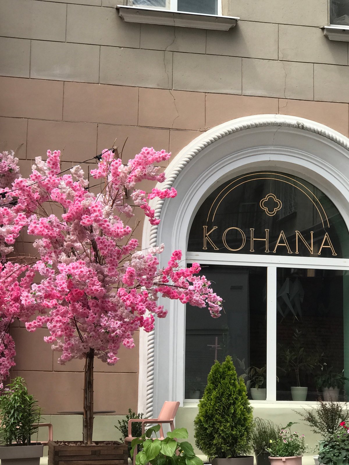 Artificial cherry blossoms decorate building facade in Kharkiv