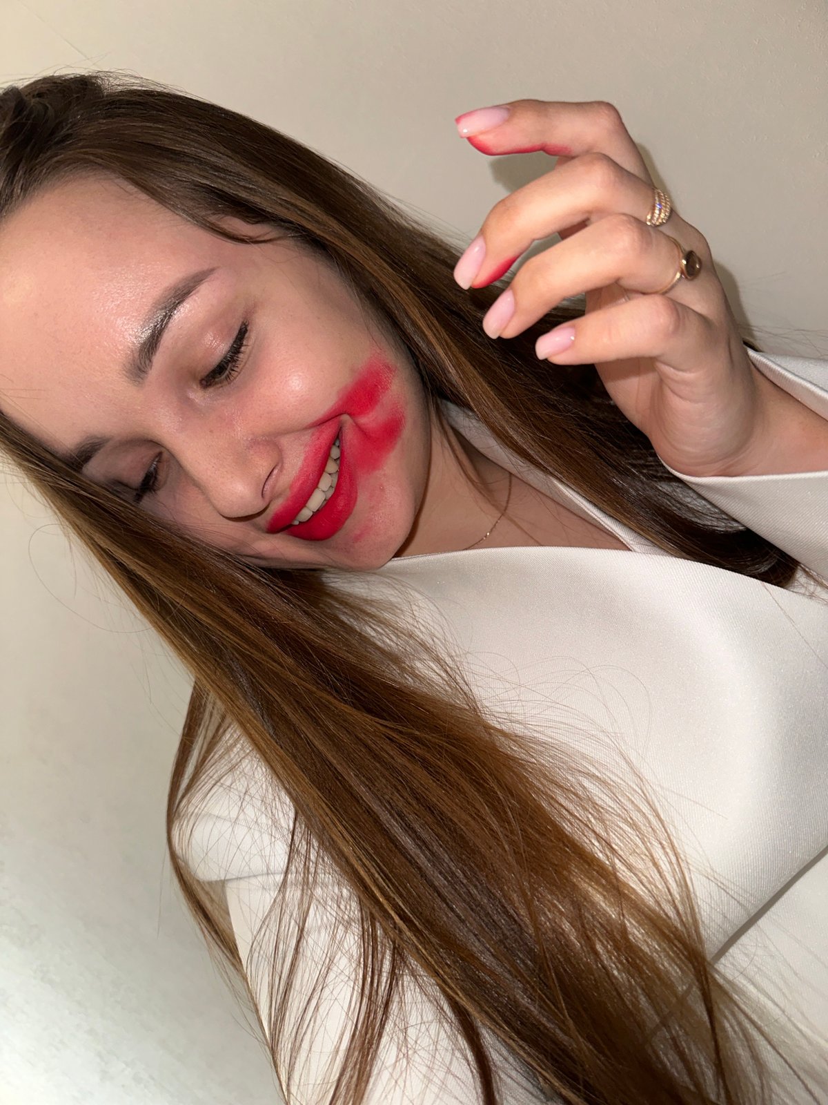 Woman takes selfies with smeared lipstick in Chaikovsky