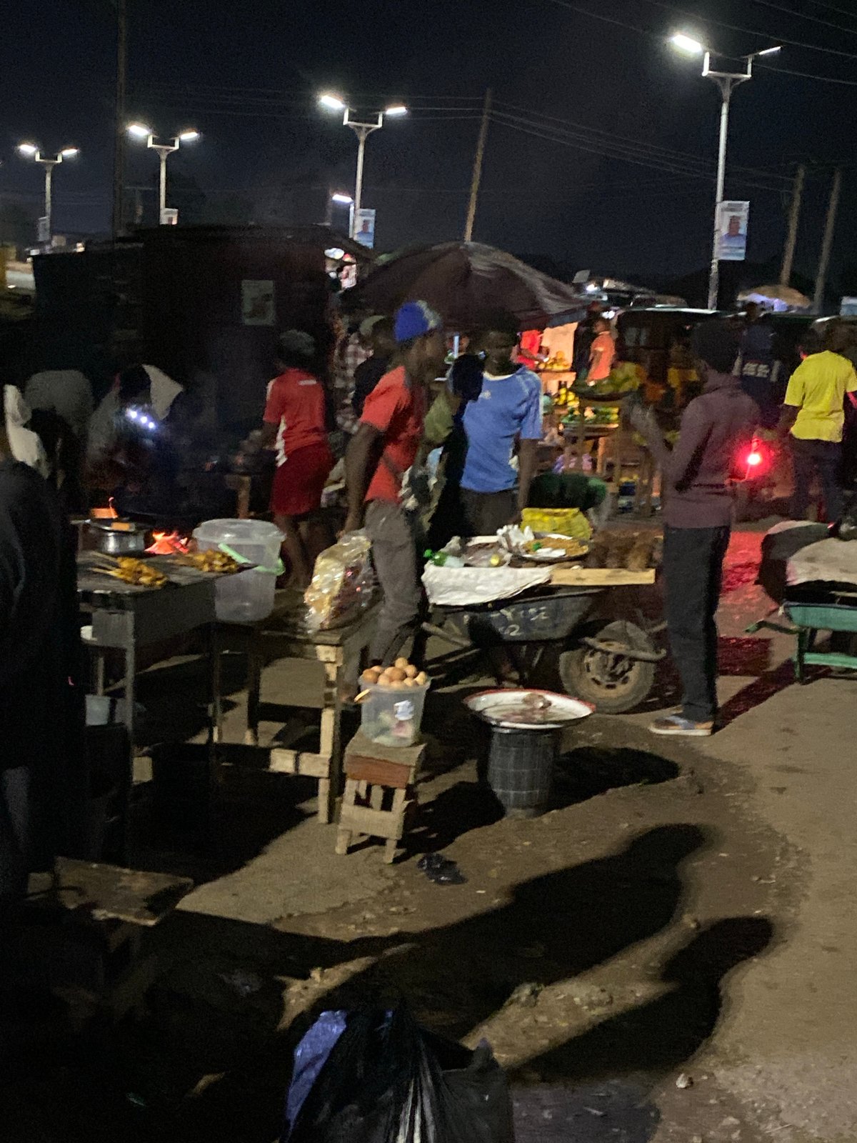 Nighttime food market bustles in Bukuru, Nigeria
