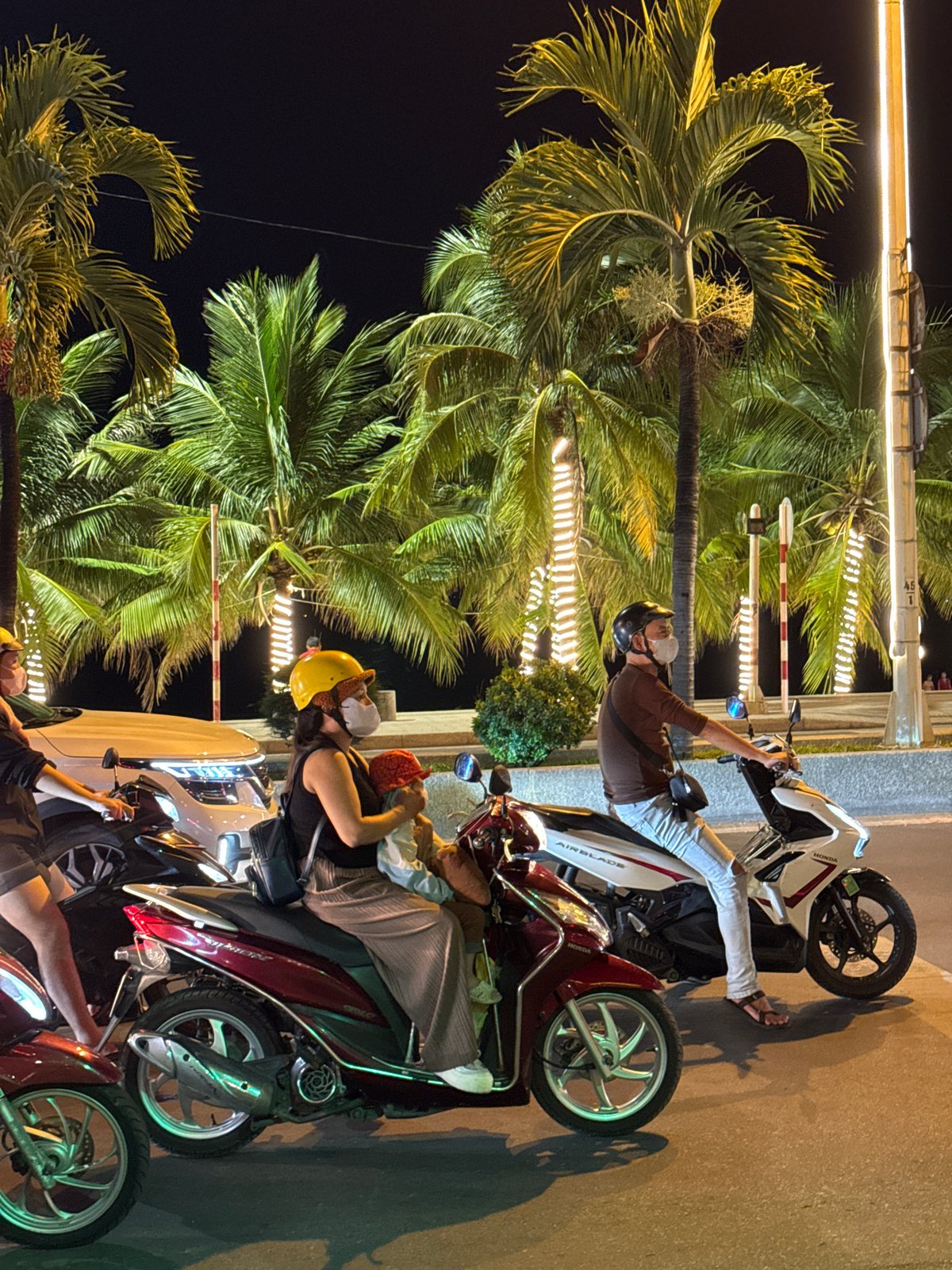 Nha Trang's nighttime promenade: fountains, motorbikes, and street life