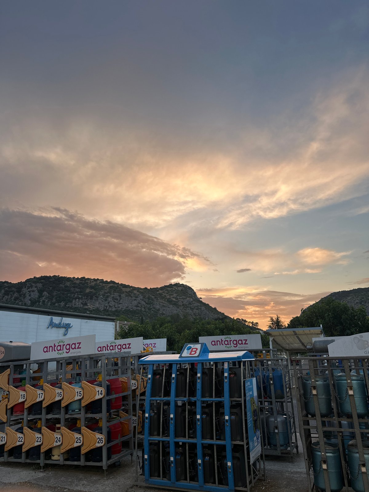 Sunset over a Super U and gas depot in Anduze