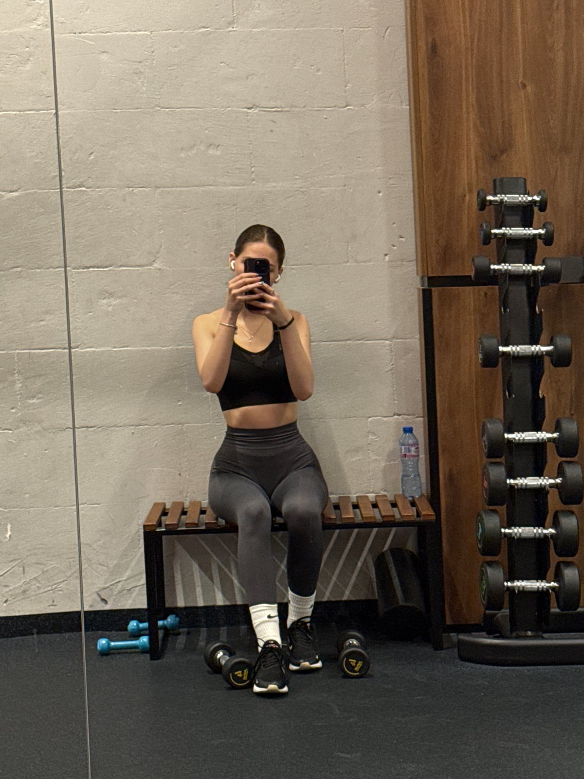 Woman takes mirror selfies during gym workout in Sofia
