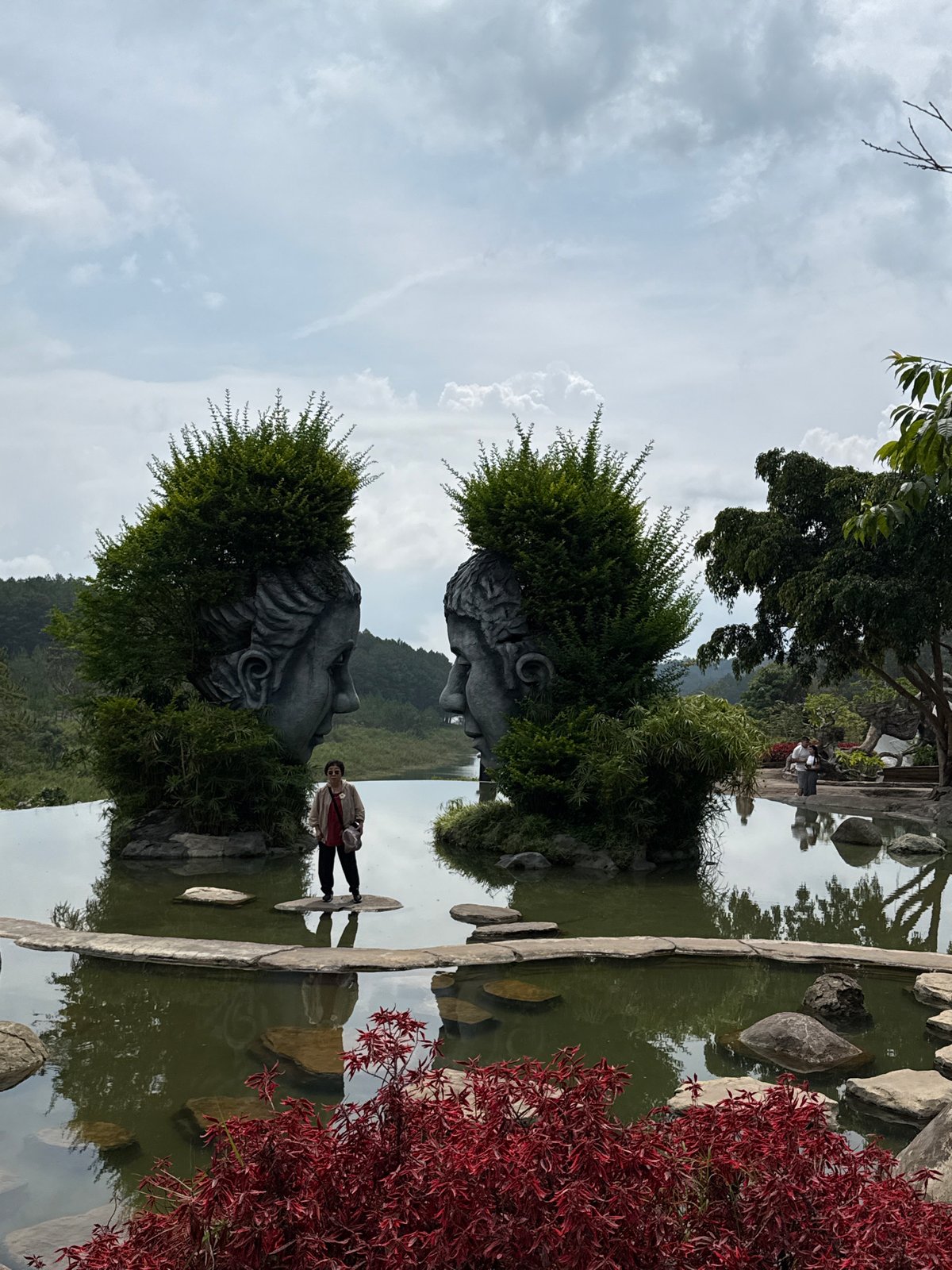 Stone busts spotted in Da Lat garden scene