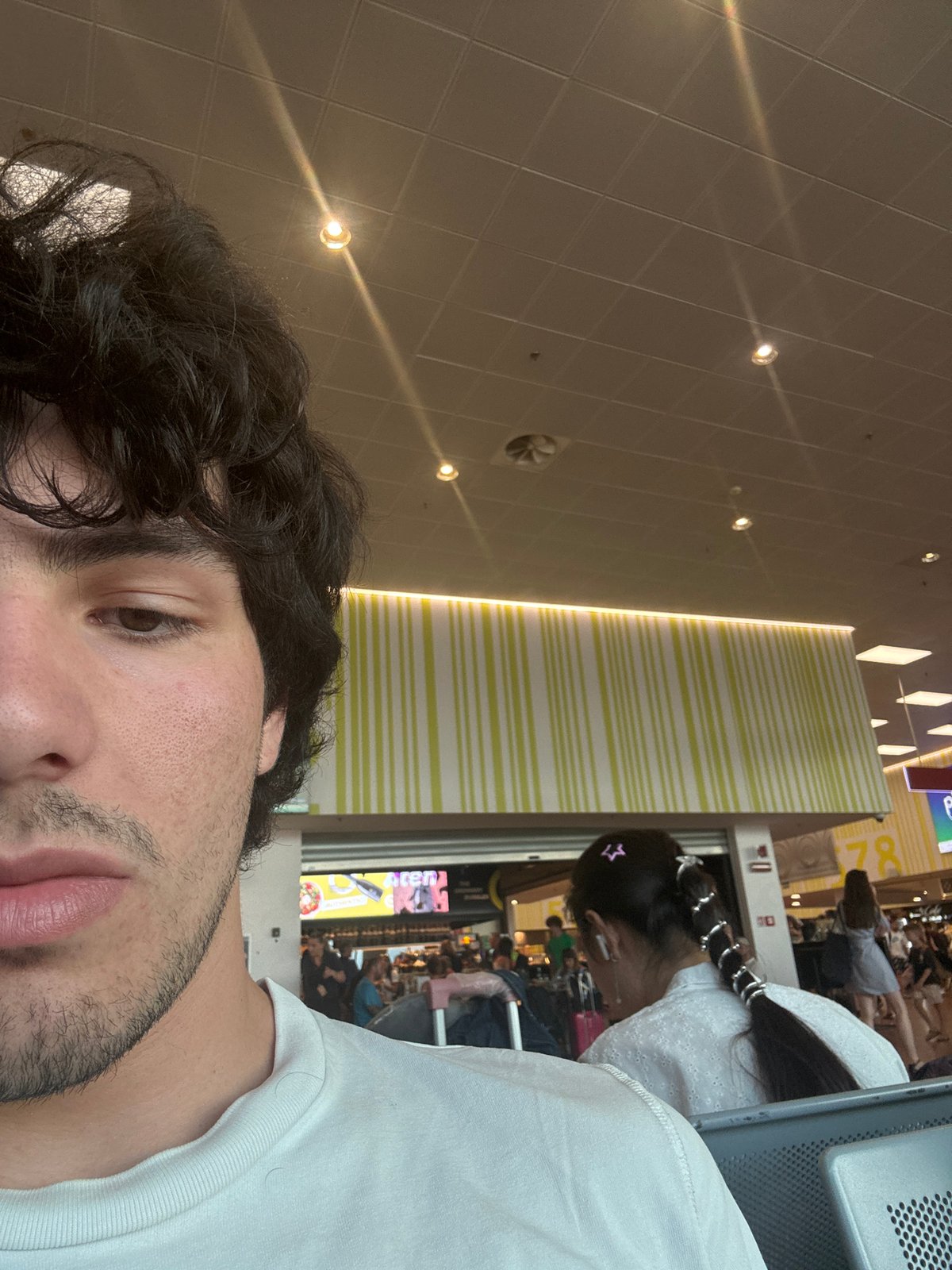 Passing time at Bergamo's Orio al Serio Airport on a summer evening