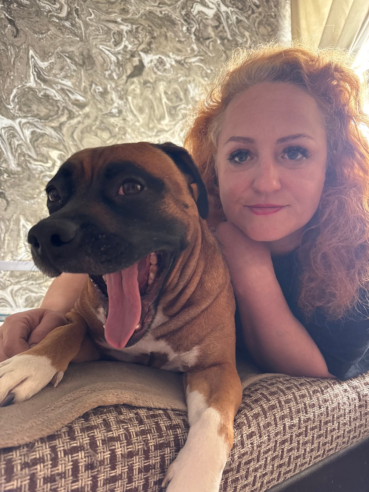 Woman and dog share quiet morning moments in Chaikovsky home
