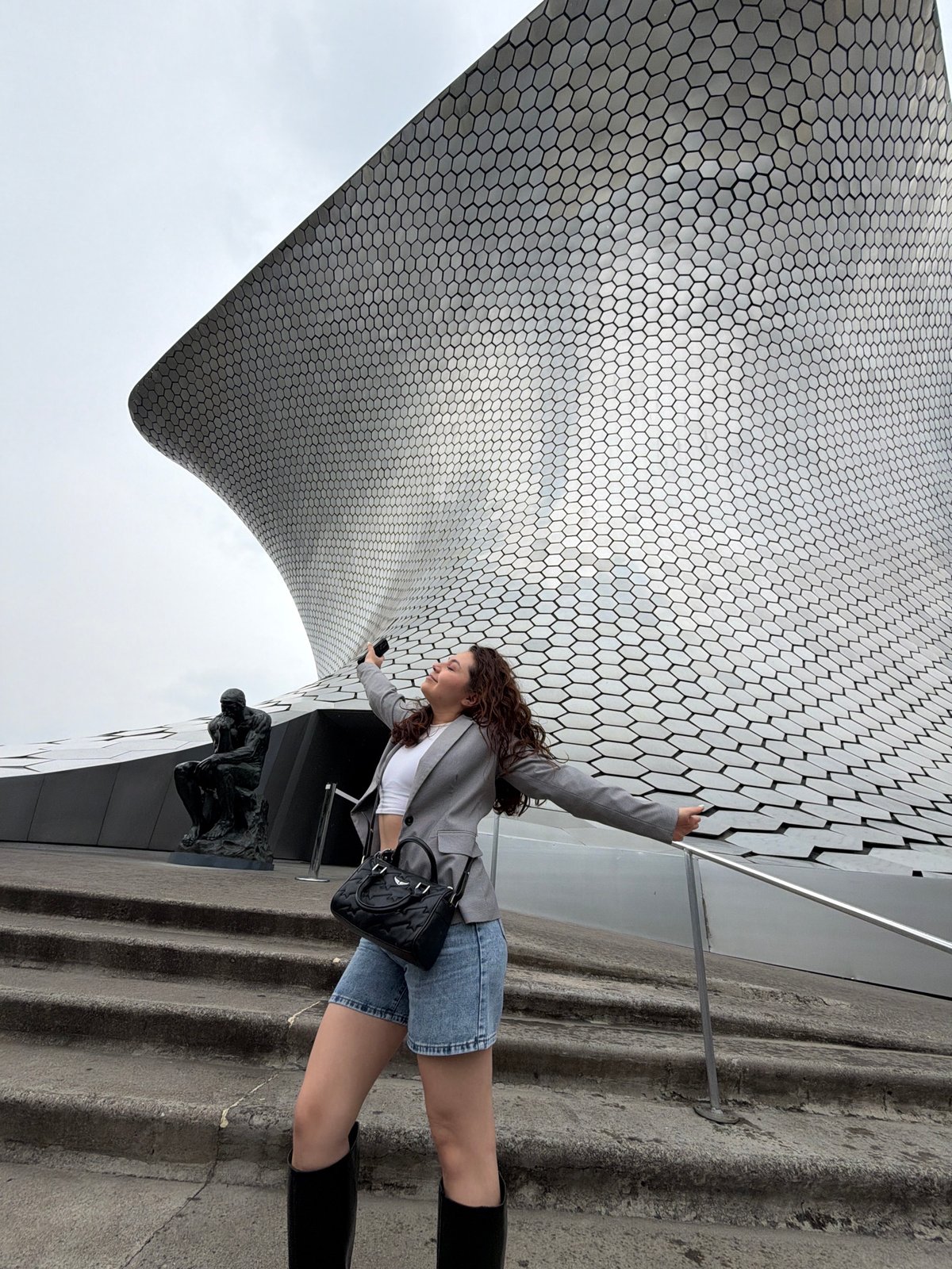 Woman poses for photos at Mexico City's Museo Soumaya