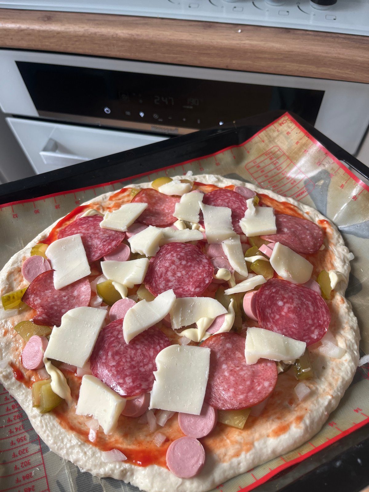 Homemade pizza and dolmades from a Voronezh kitchen