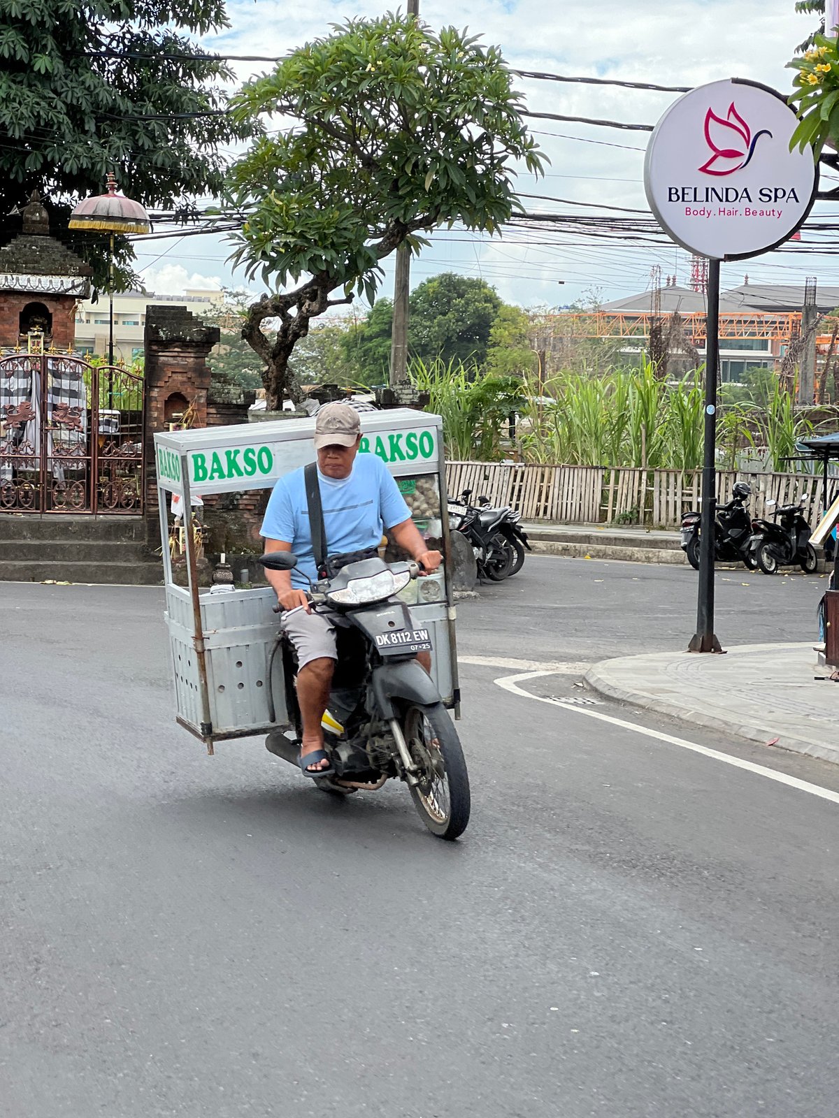 Denpasar streets alive with scooters, deliveries, and daily movement