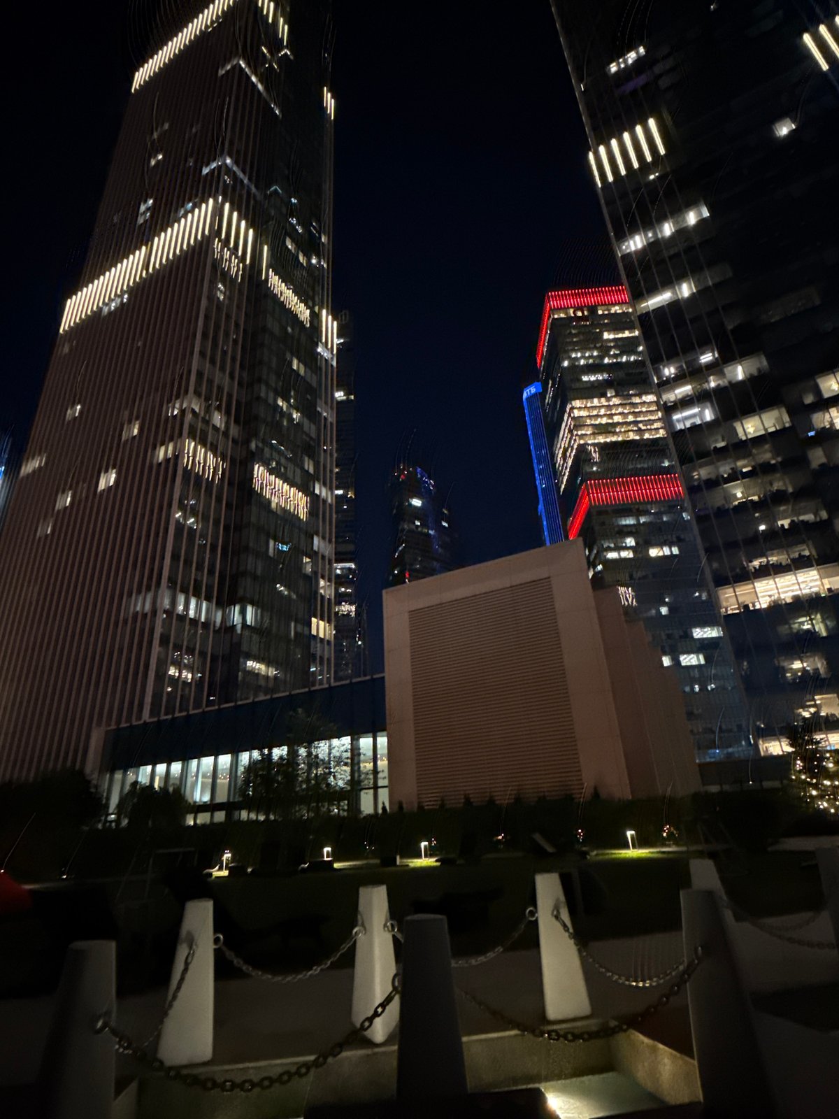 Moscow City towers glow at night from multiple angles