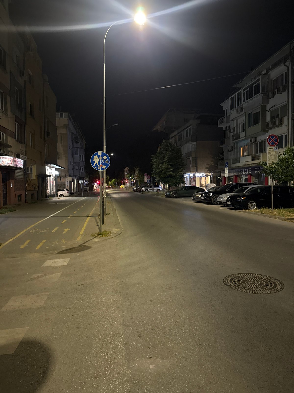 Varna street at night, bike lanes and parked cars