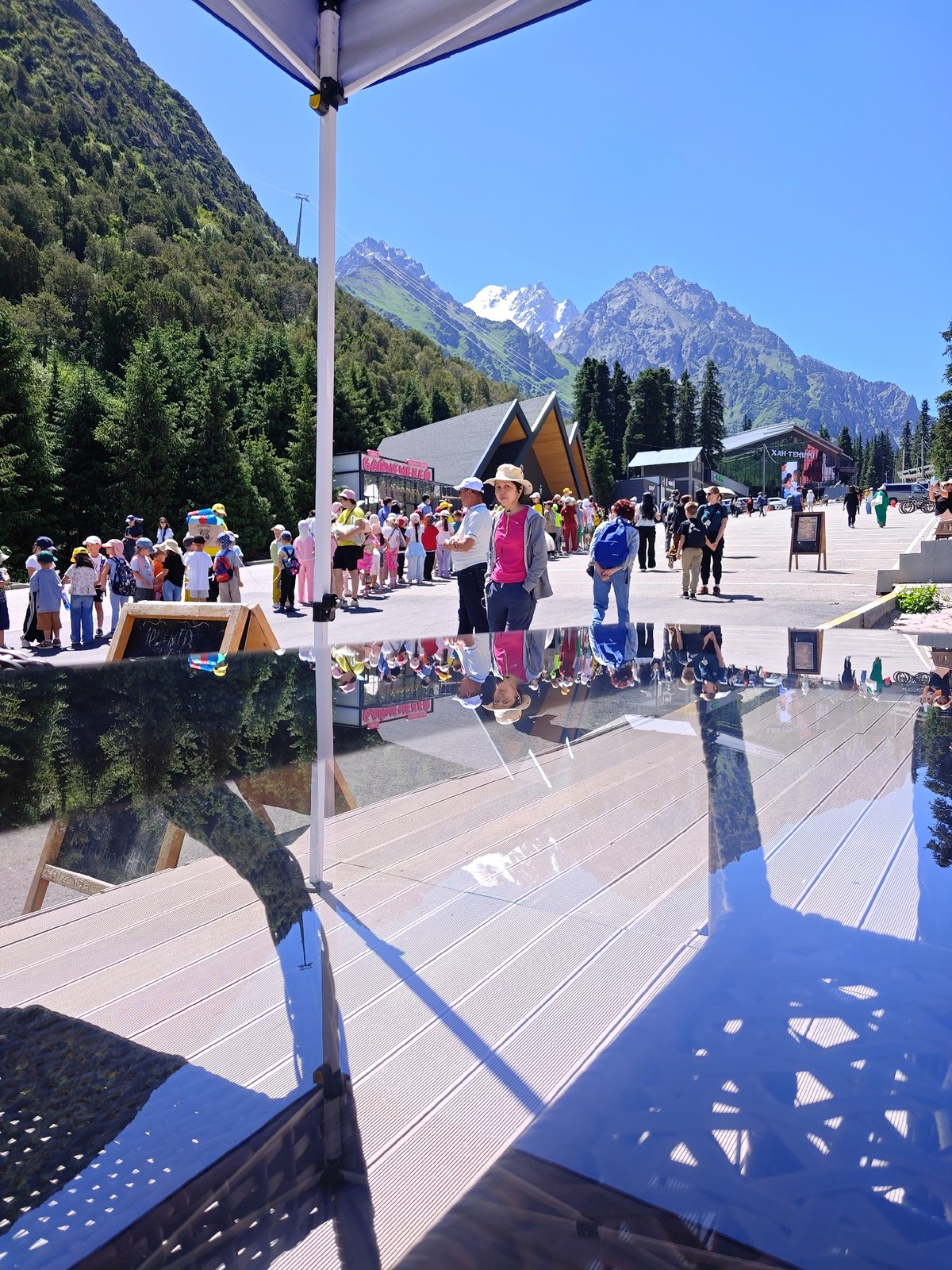 Kids hiking in line through a sunny mountain destination