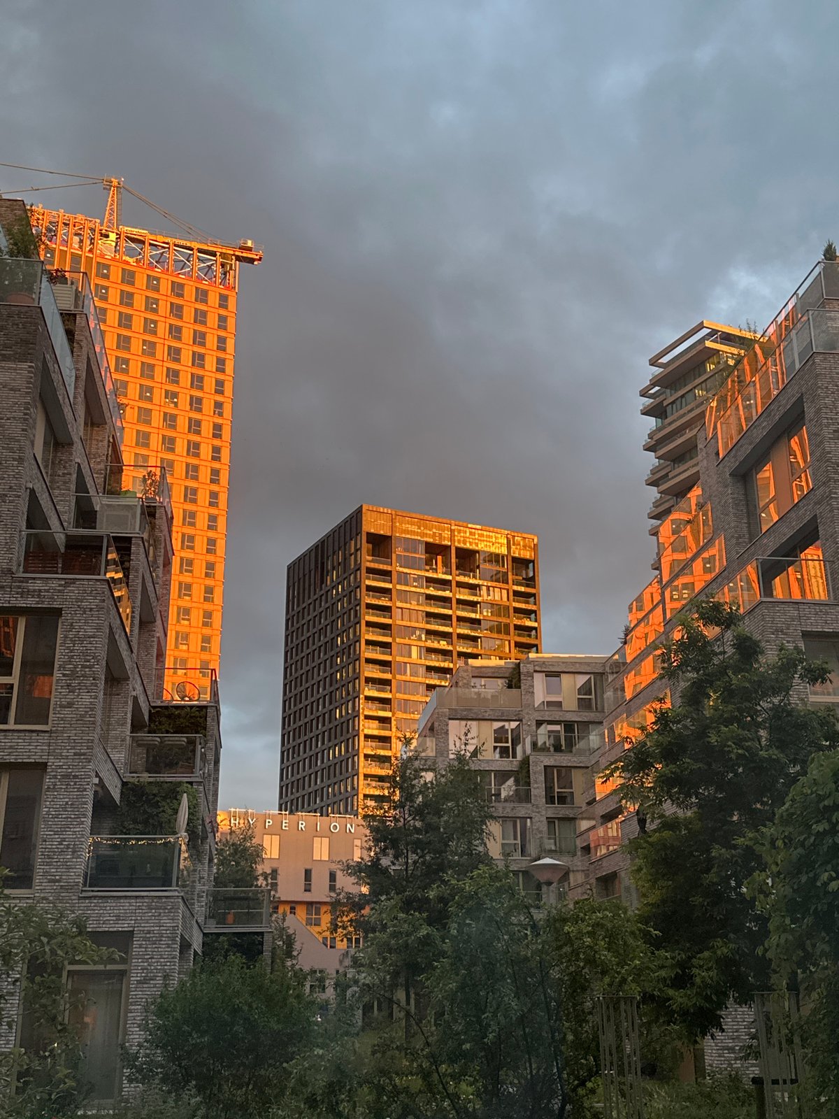 Amsterdam sunset illuminates modern buildings during evening documentation session