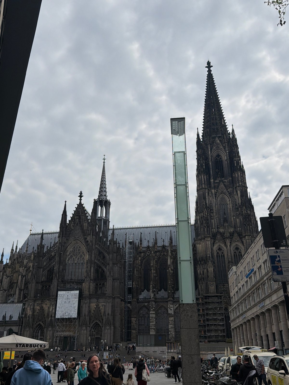 Cologne Cathedral district documented during cloudy afternoon street activity