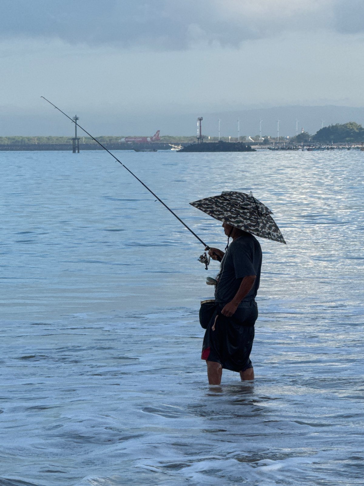 Evening beach life documented across Kuta, Indonesia during sunset