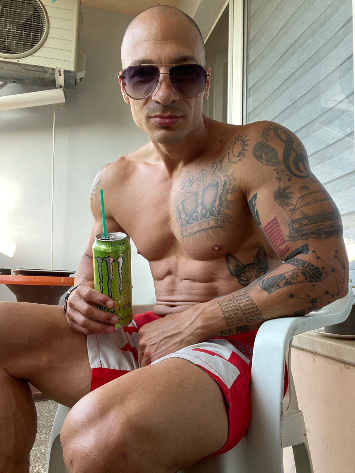 Man drinks energy drink outdoors in Pleven, Bulgaria