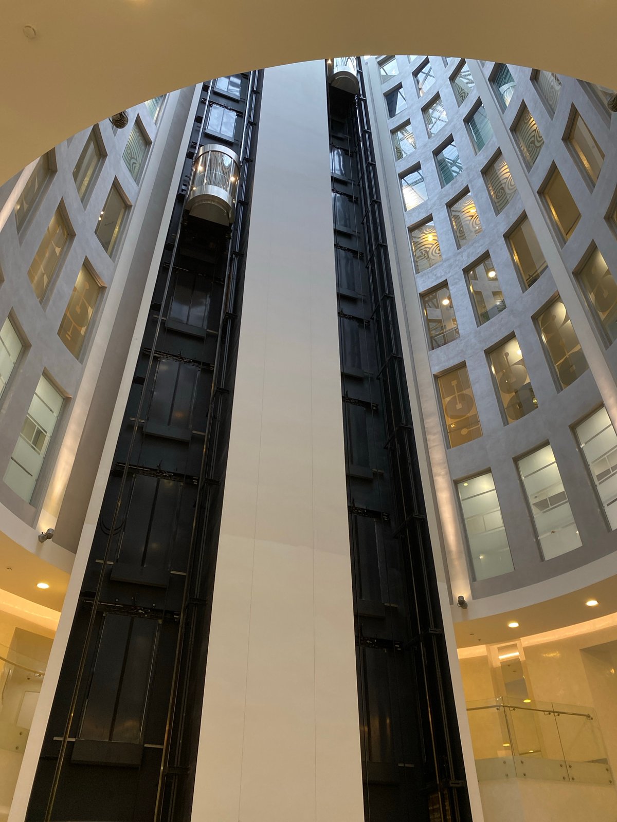 Glass elevator viewed from below in a Saint Petersburg atrium