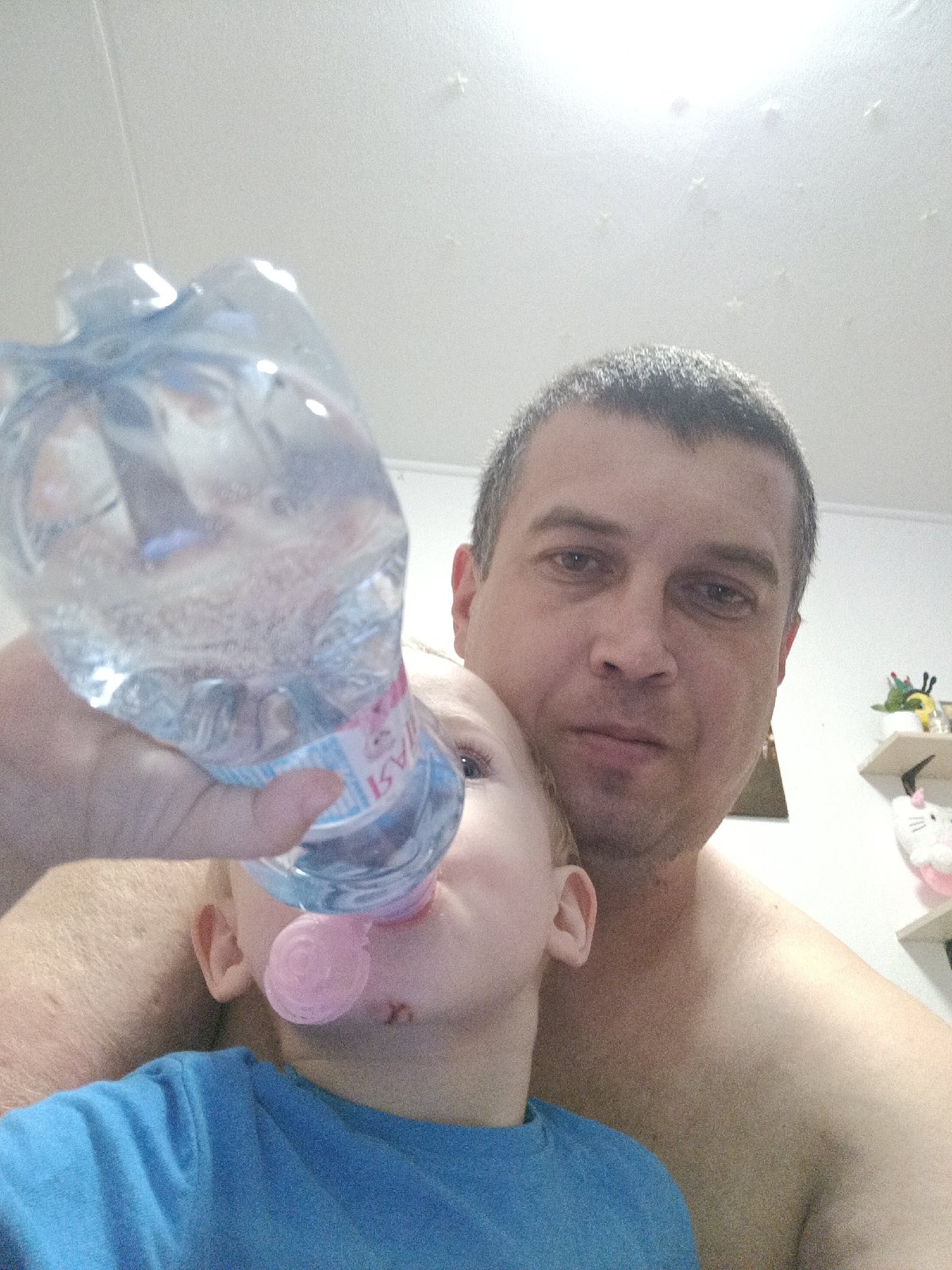 Lazy evening indoors with a tabby cat and a toddler