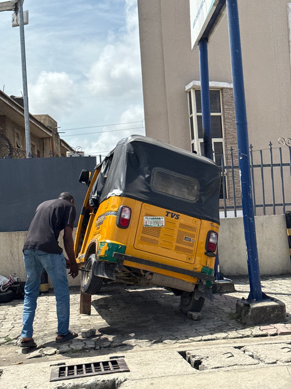 Yellow motorcycle taxi spotted parked in Ado, Nigeria