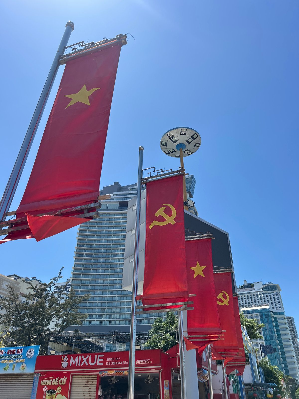 Vietnamese flags displayed along Nha Trang Ward street