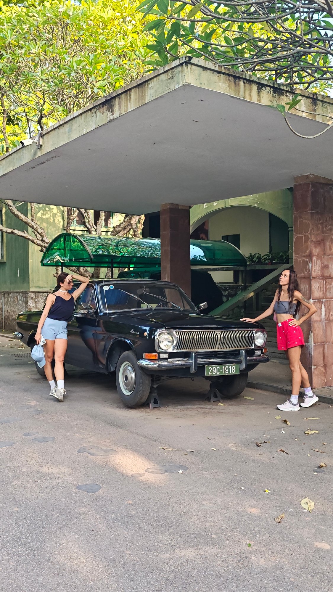 Tourists explore historical sites and vintage vehicles in Hà Nội