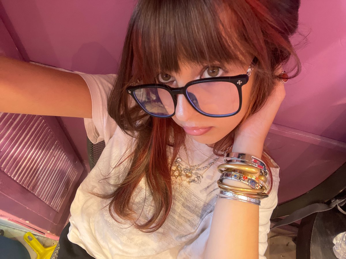 Selfie session in Raanana showcasing glasses, rings, and nail art