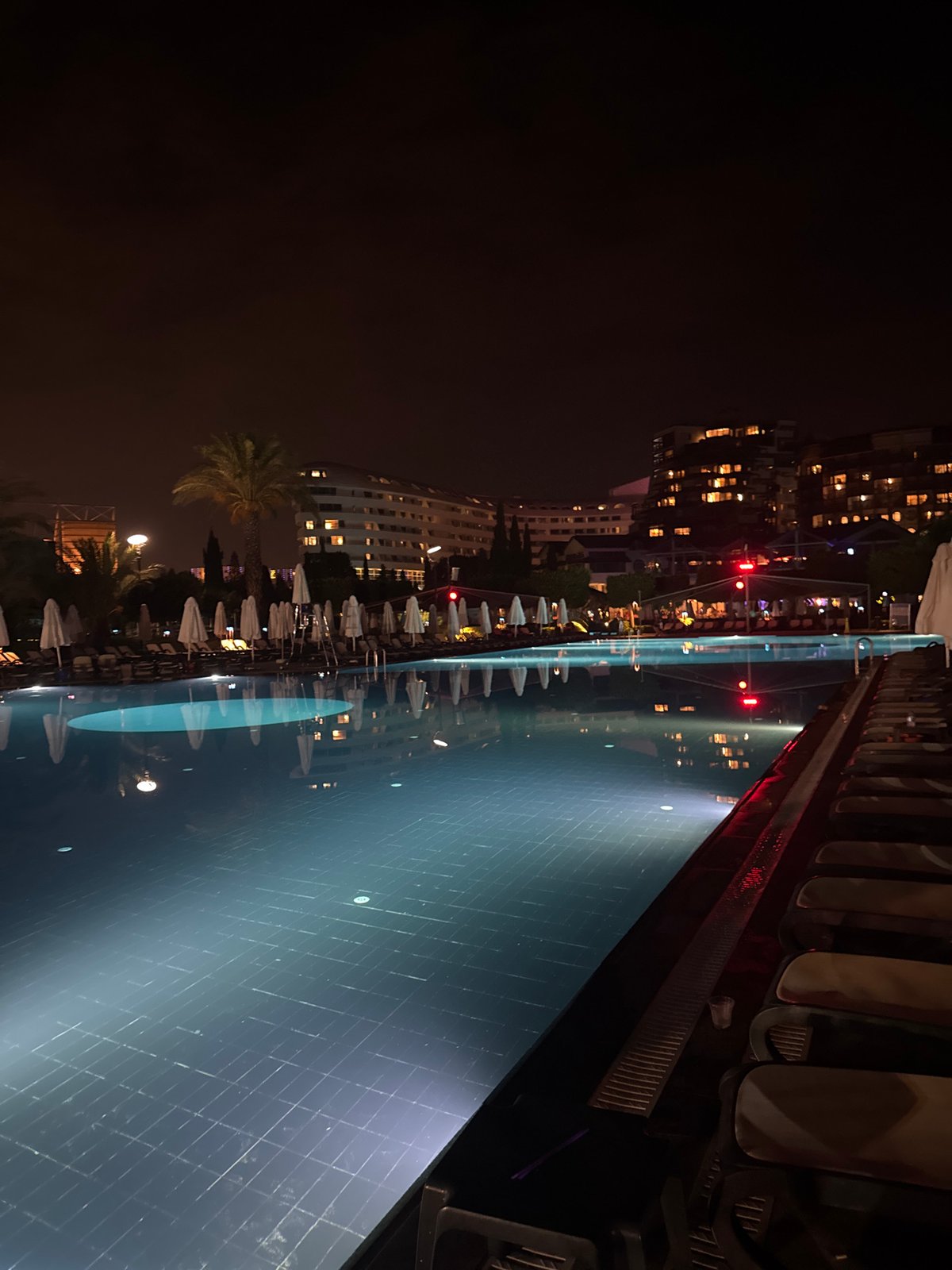 Family Carnival night at an Aksu resort pool and grounds