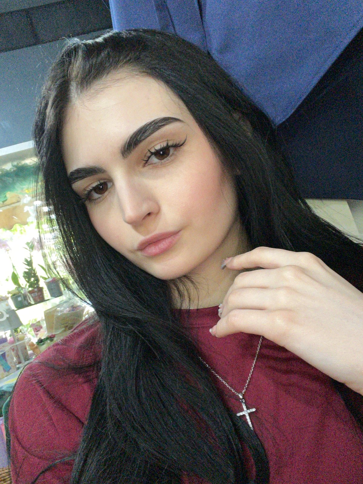Woman poses for photos in Burgas flower shop