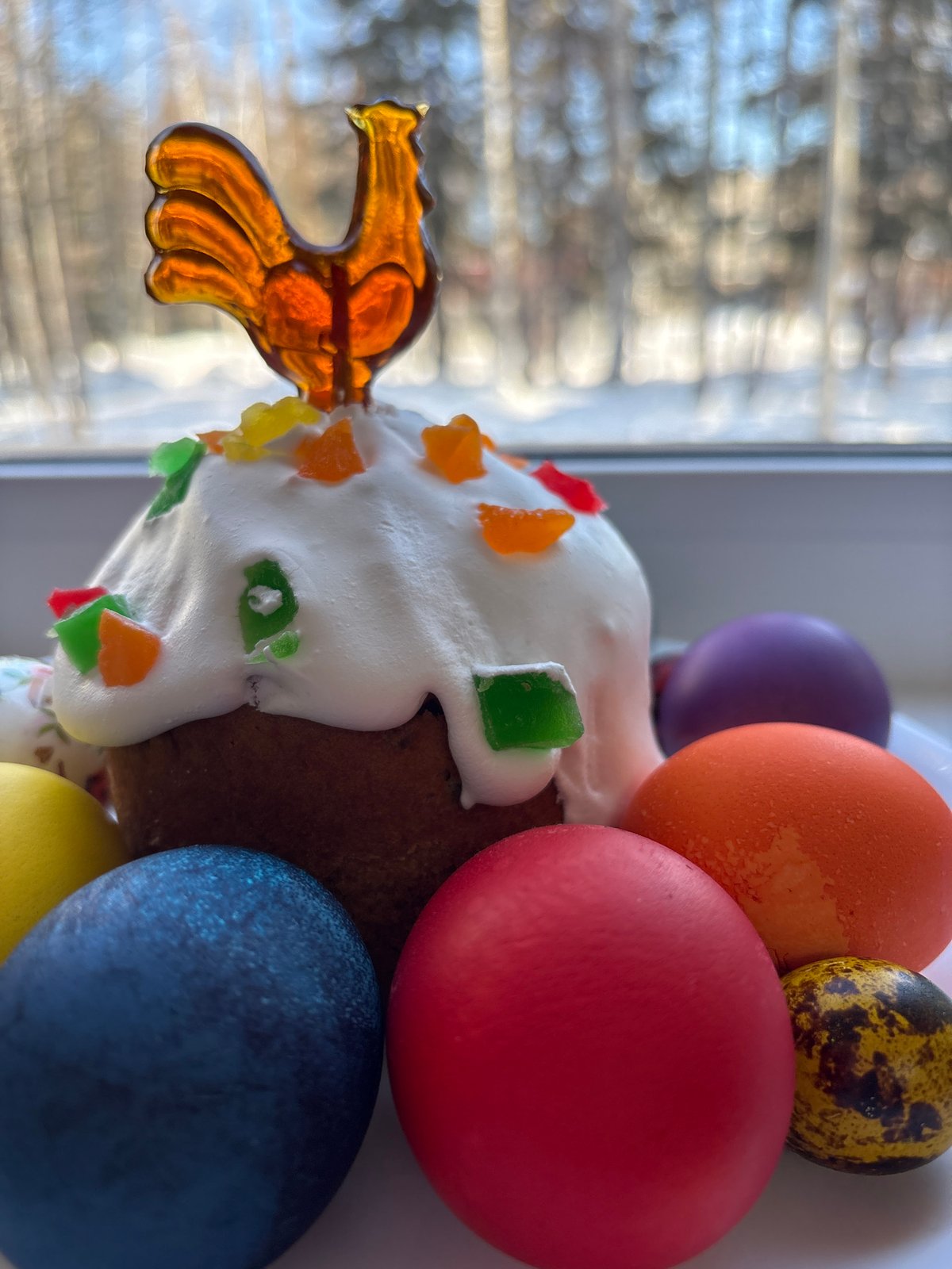 Easter traditions observed in Ust-Ilimsk with decorated cake, colored eggs