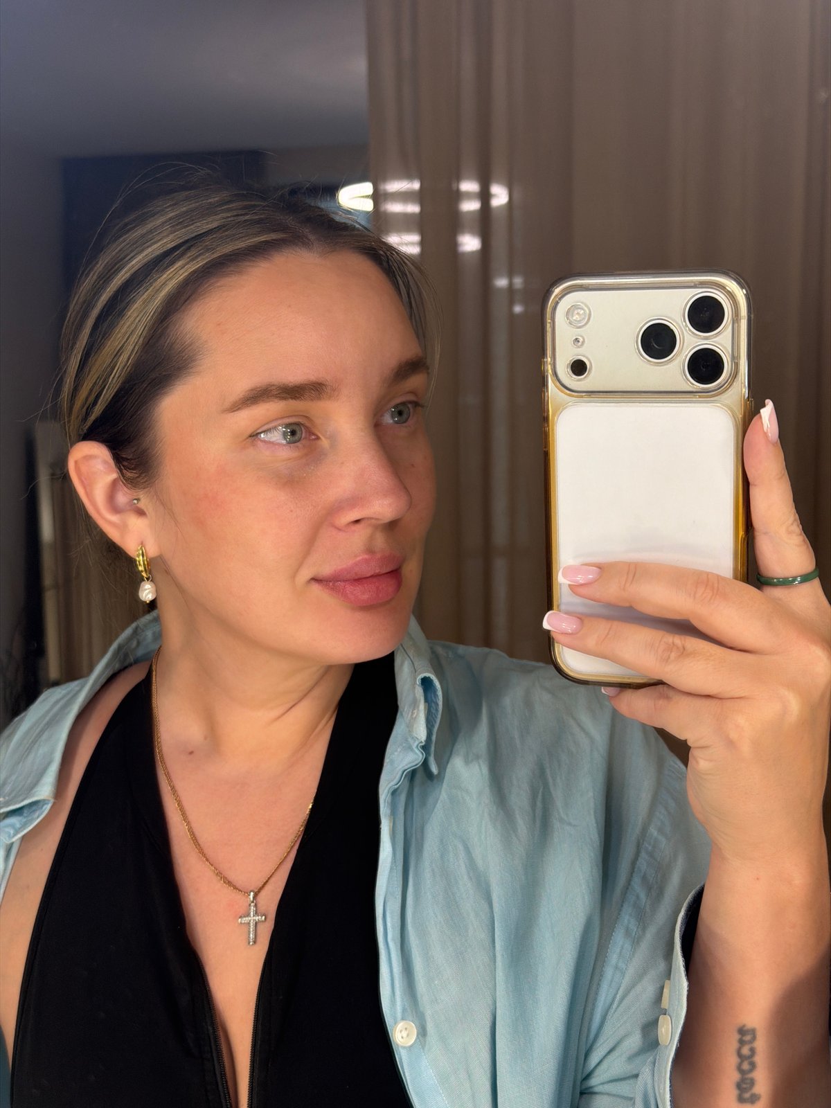 Woman takes selfie with multi-camera smartphone
