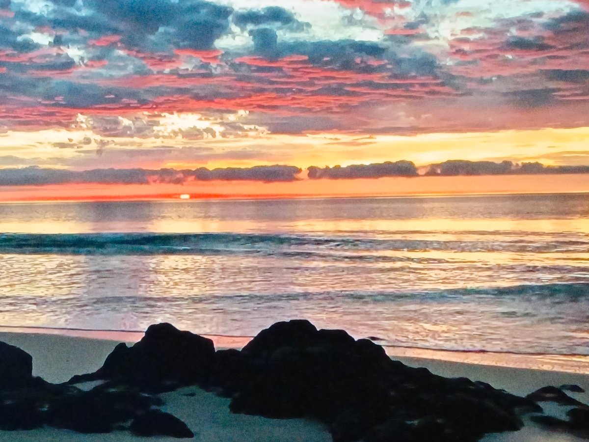 Colorful sunrise observed at Venezuelan beach near Juan Griego