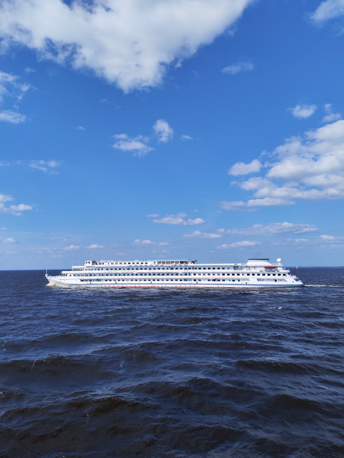 River cruise ship underway on open water, Veregonets