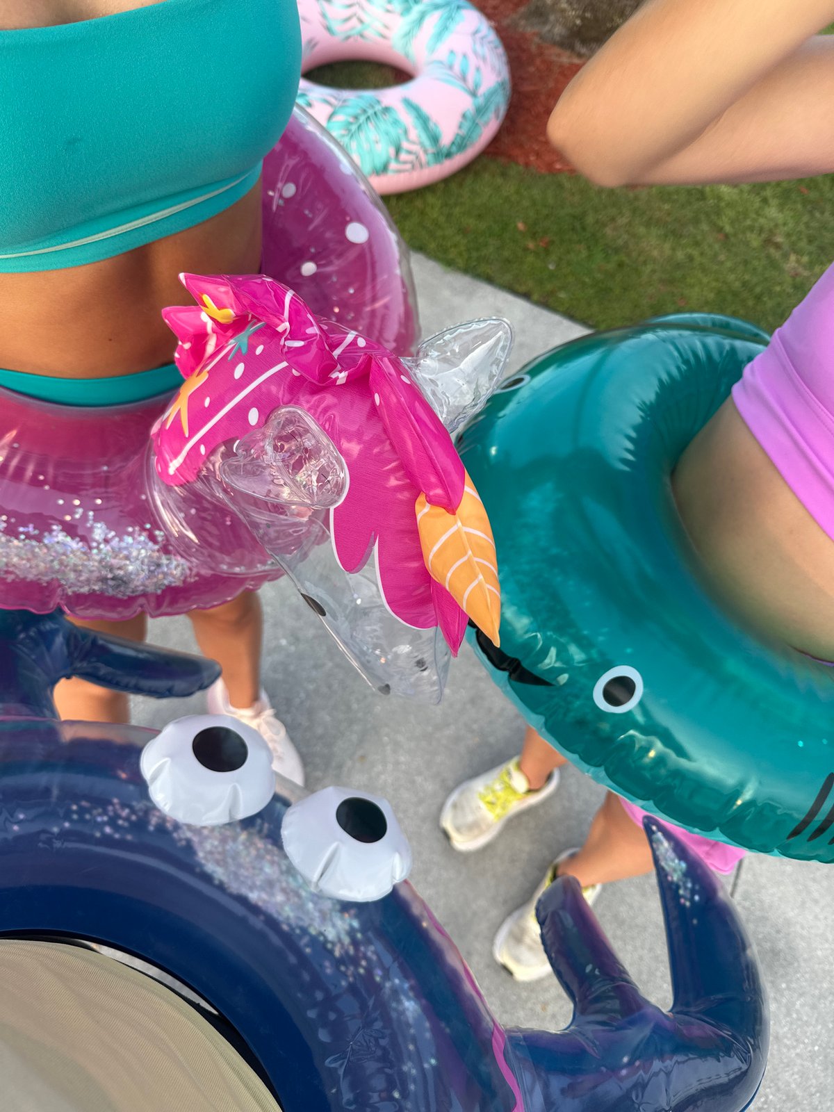Group spotted wearing swimming rings on concrete in Boca Raton