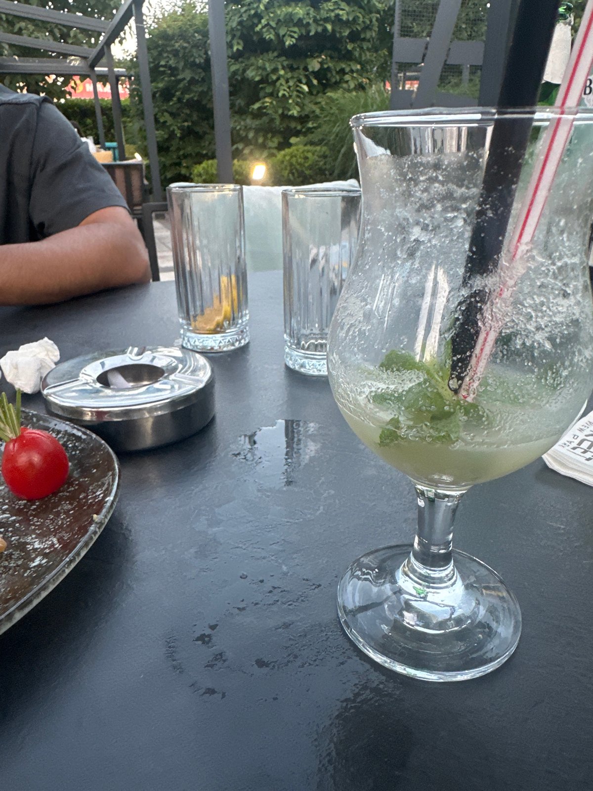 Casual outdoor hangout, drinks winding down