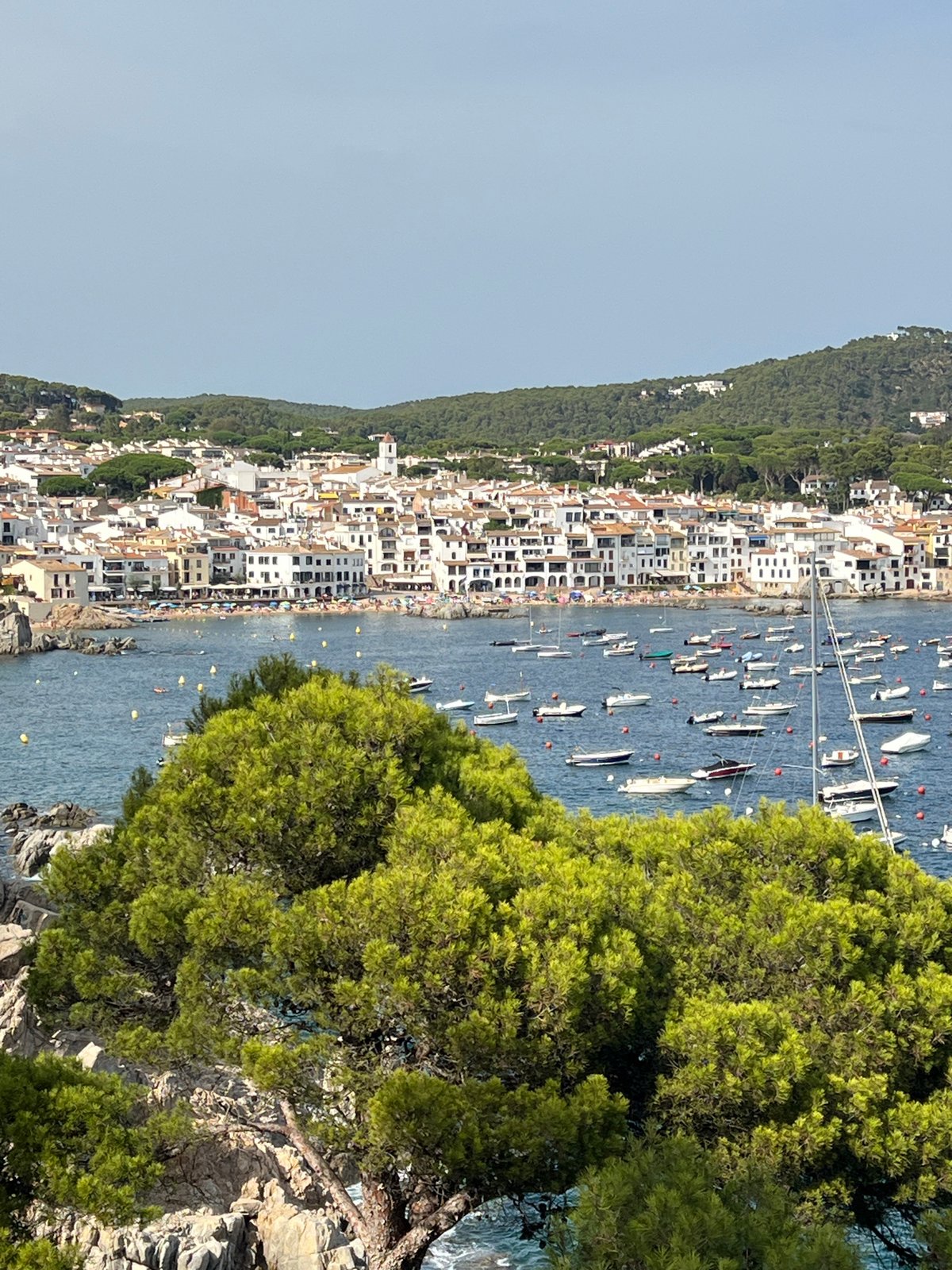 Crowded summer beach day at Calella de Palafrugell