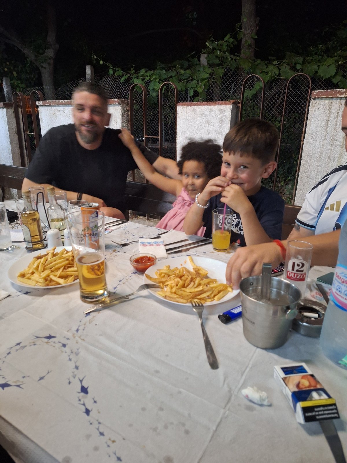 Outdoor dinner gathering at a Blagoevgrad restaurant, July evening