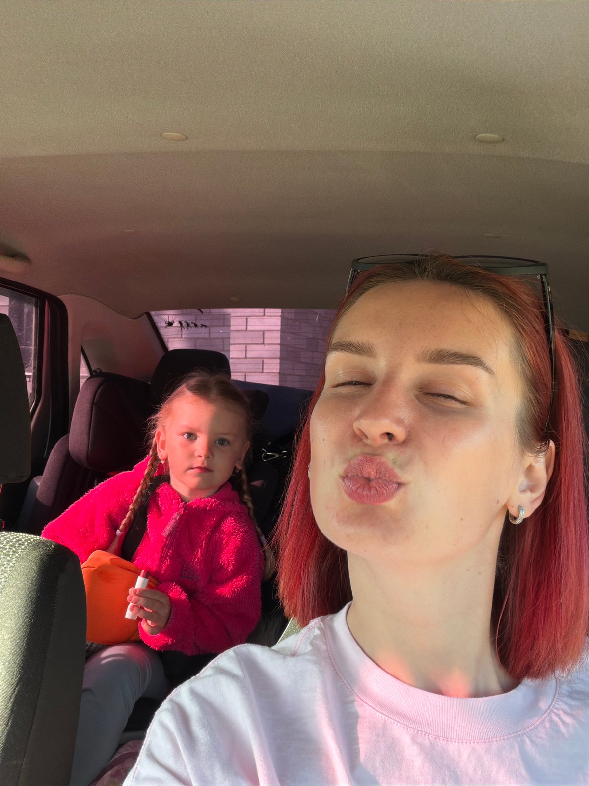 Woman takes car selfies with child in Chaikovsky, Russia