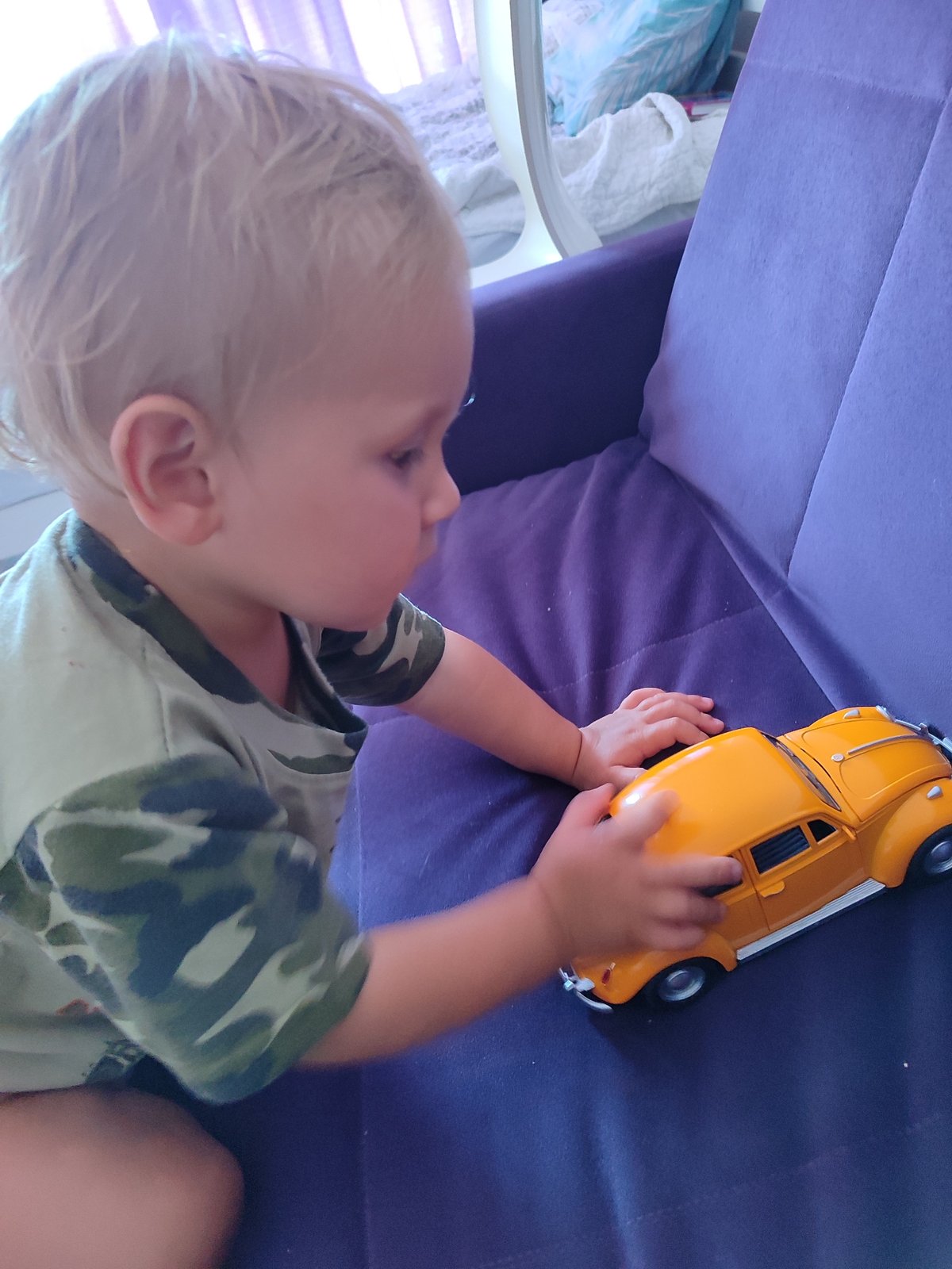 Domestic morning in Sochi: a toddler, fresh strawberries, and backyard views