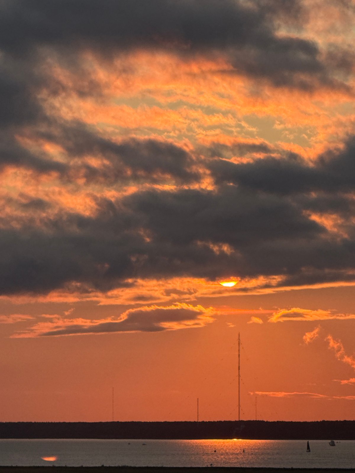 Gulf of Finland sunset lights up a cloudy Saint Petersburg sky