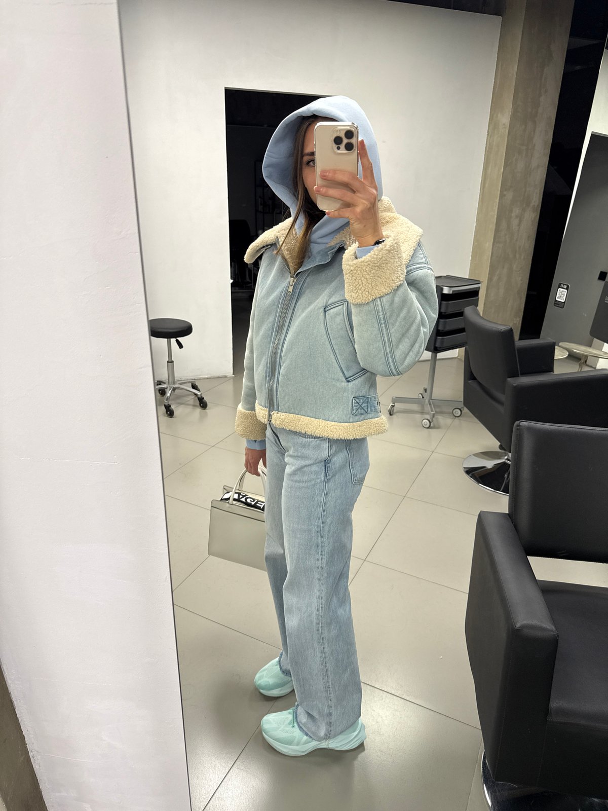Woman takes selfies at Saint Petersburg hair salon