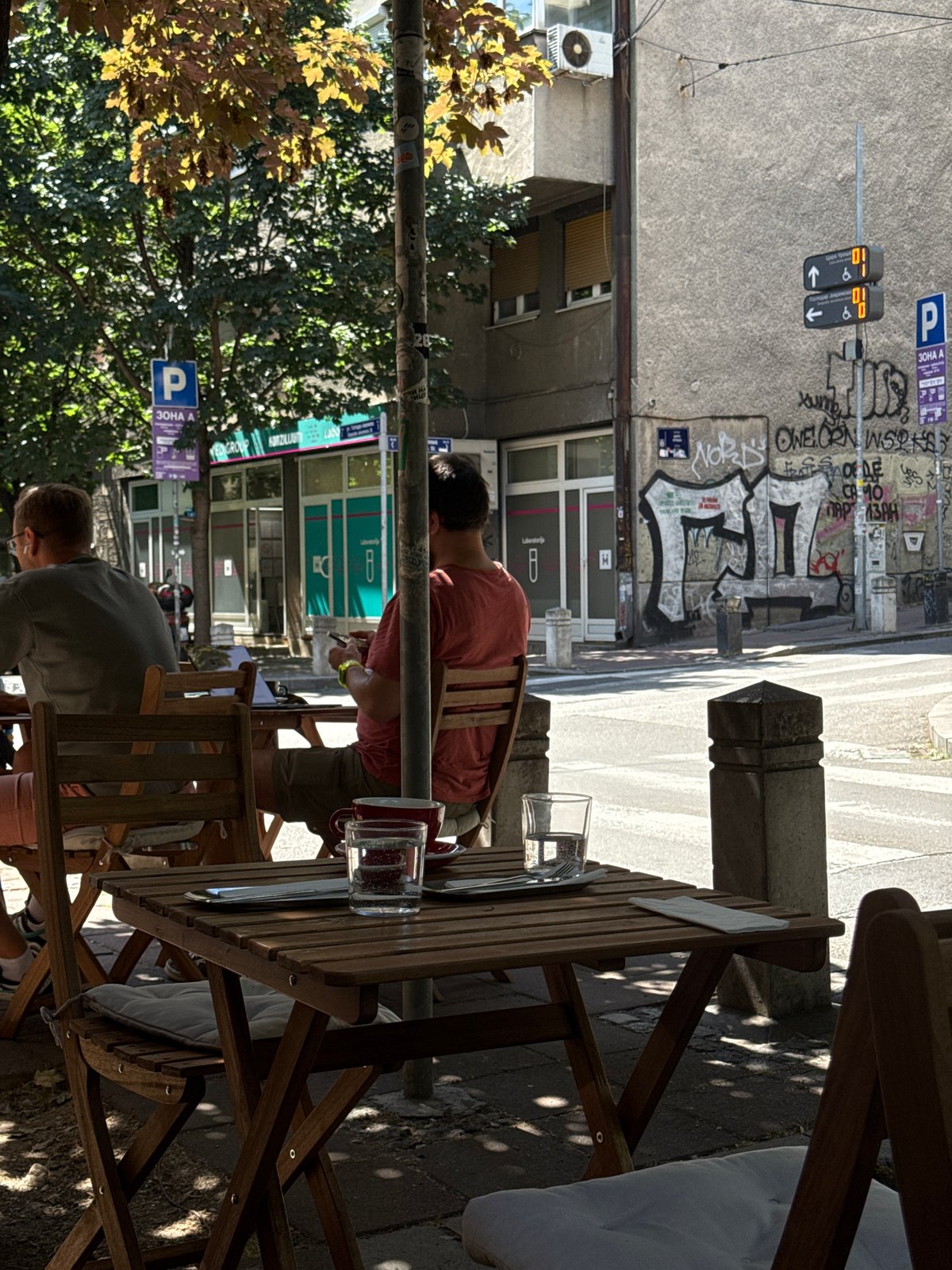 Morning cafe life documented on Belgrade's Tsar Uroša Street