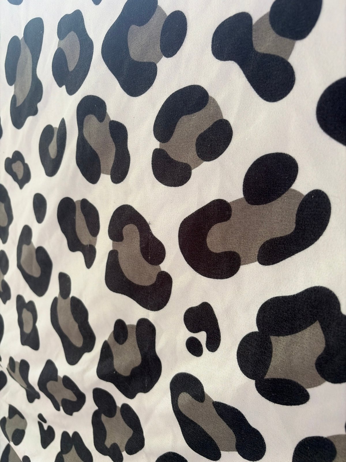 Leopard fabric and blooming yucca, close up in Baurene