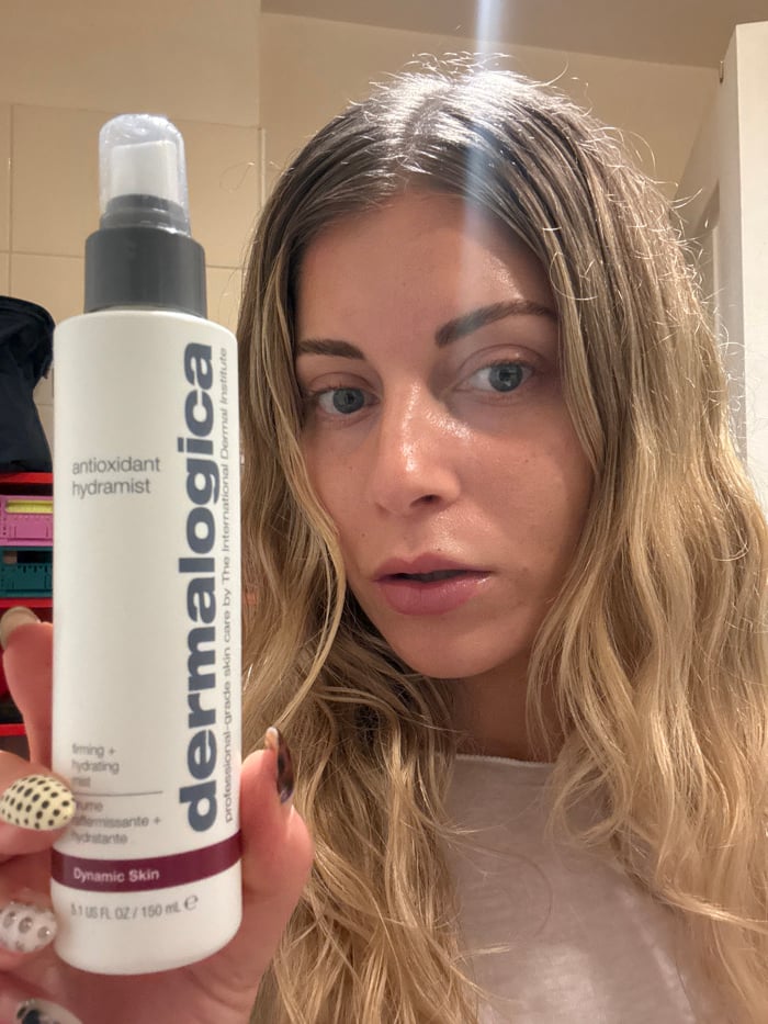 Woman documents comprehensive skincare routine in Paris bathroom