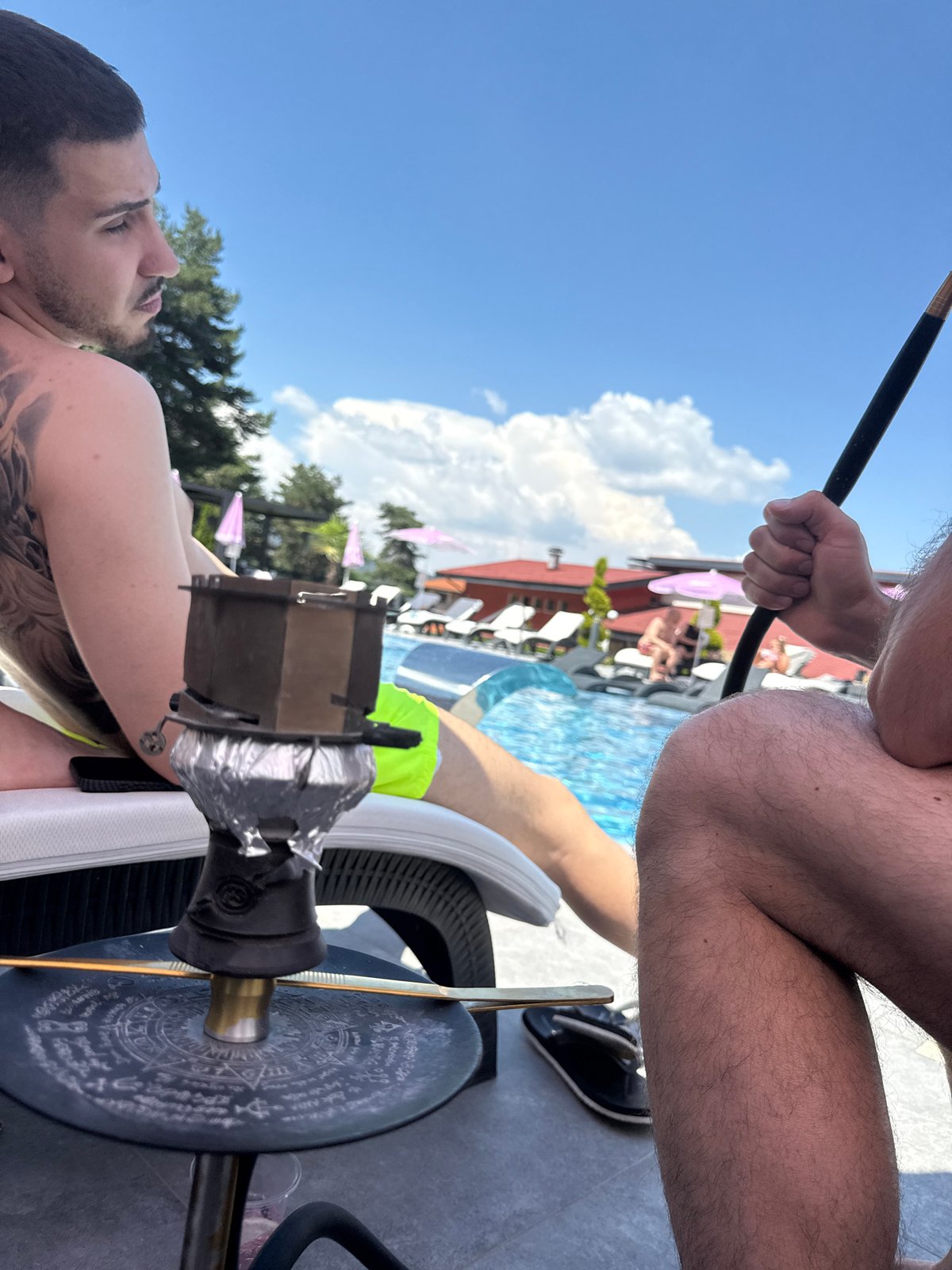 Poolside downtime at a Bulgarian resort on a sunny afternoon