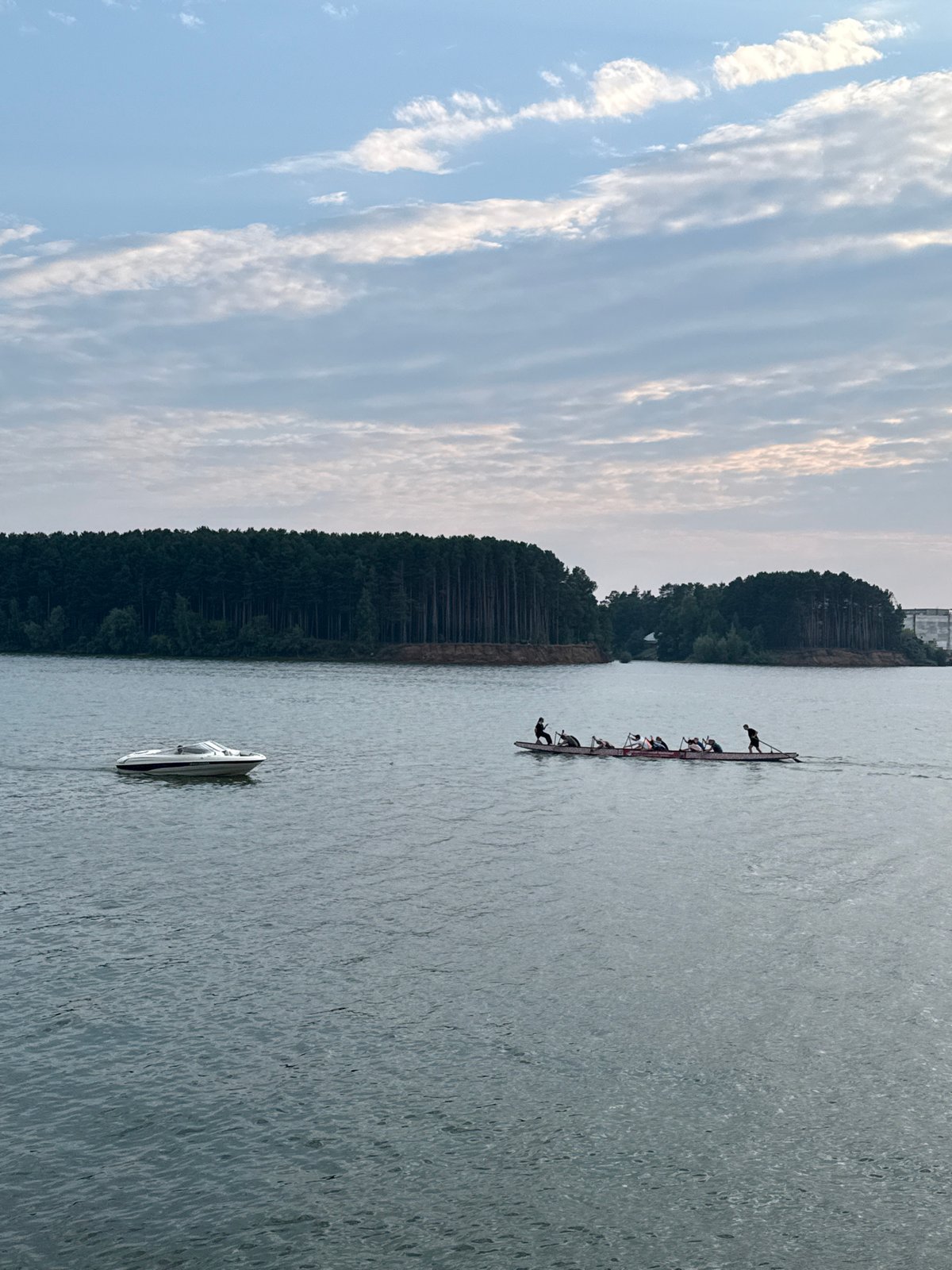 Afternoon on the Kama River: boats, fishing, and pine shores