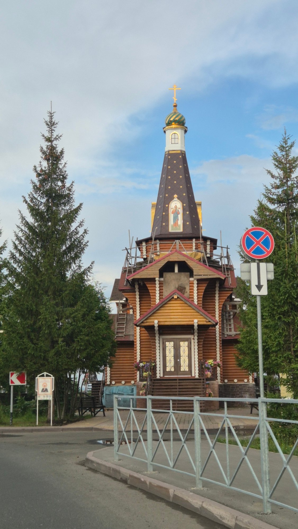 Wooden Orthodox church with green dome in Kemerovo, Russia